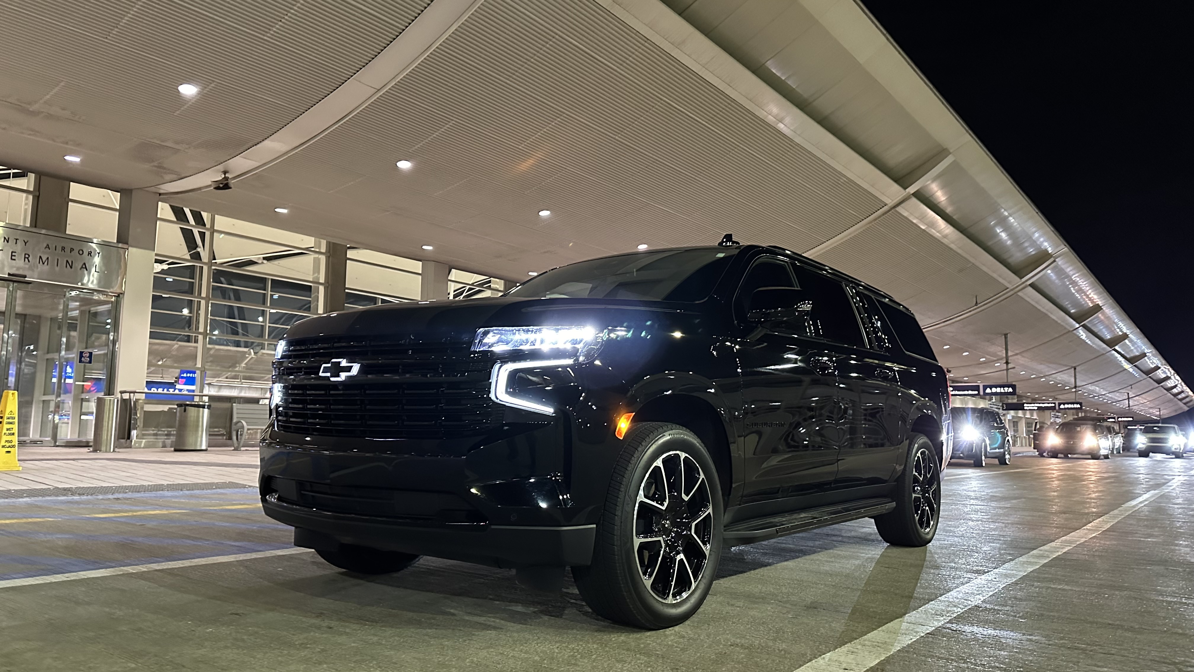 LuxeDetroit Chevrolet Suburban waiting at the Detroit Metro Airport terminal